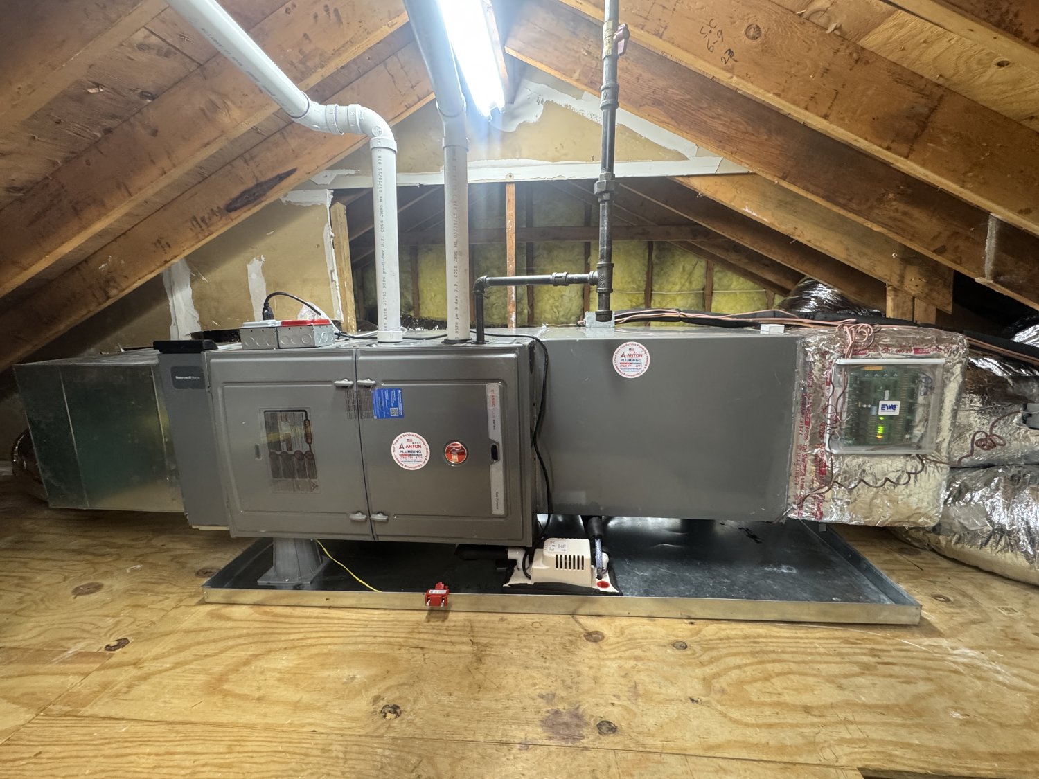 Indoor unit of a central HVAC in an attic.