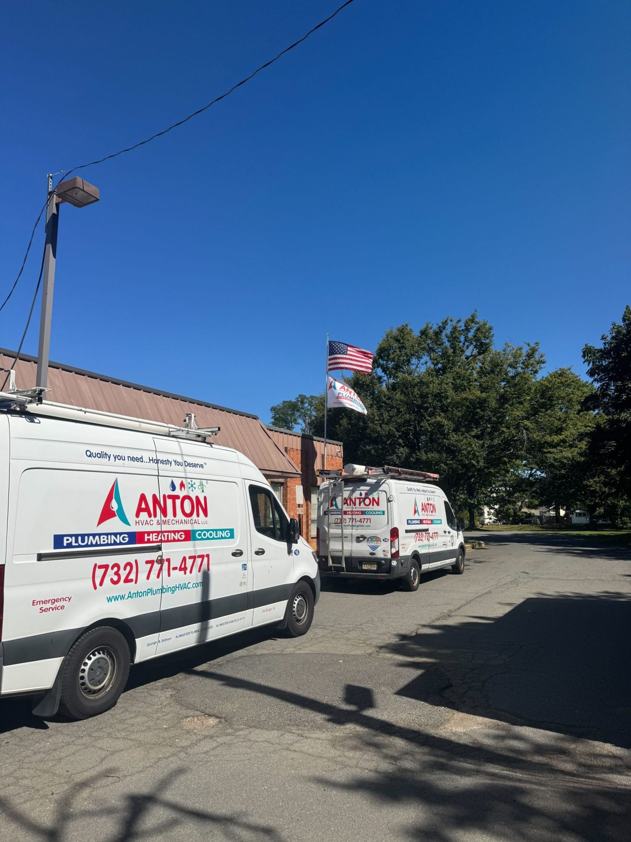 Anton-branded plumbing and HVAC service vans